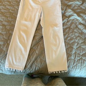 Cropped white slacks with Pom Pom decorations on pant legs!